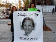 Bridget Tolley, right, with a poster of her mother, Gladys Tolley, who was struck and killed by a police car in Quebec in 2001. Photo: Bridget Tolley